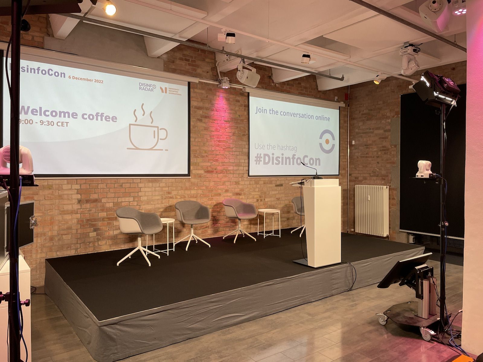 Stage with projection screens for a hybrid event at Spreespeicher