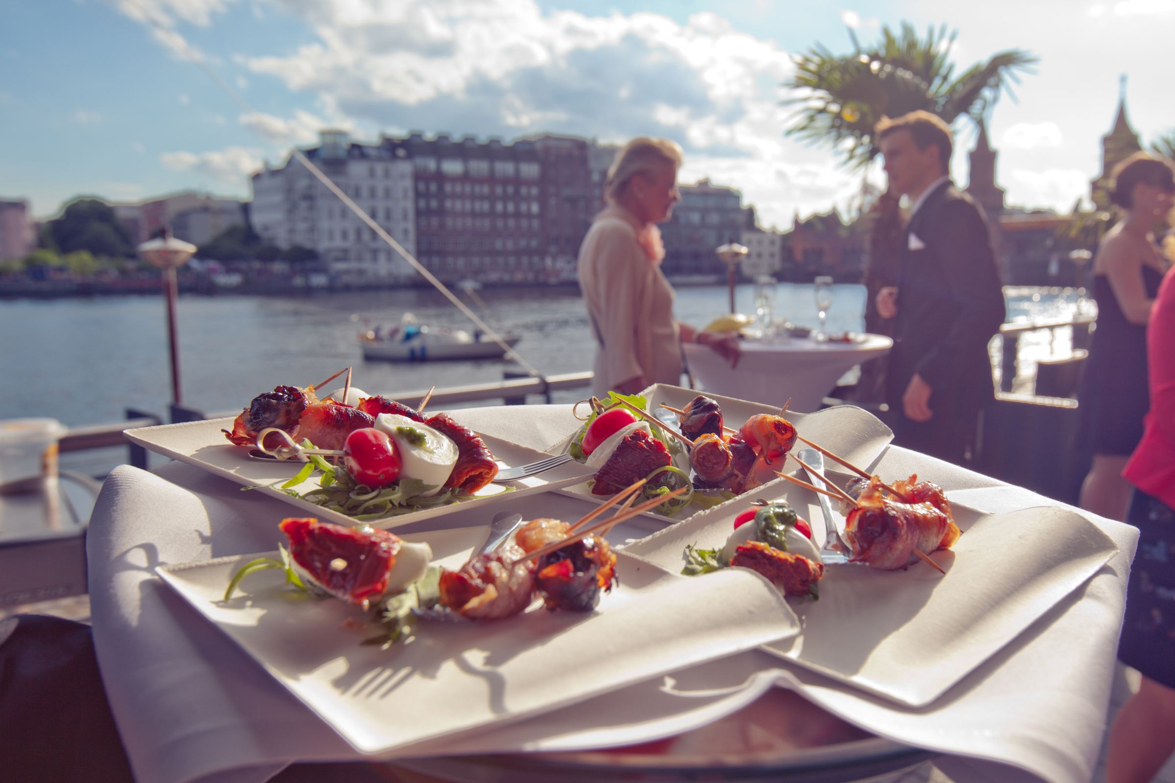 Finger food on the Spree terrace overlooking the river
