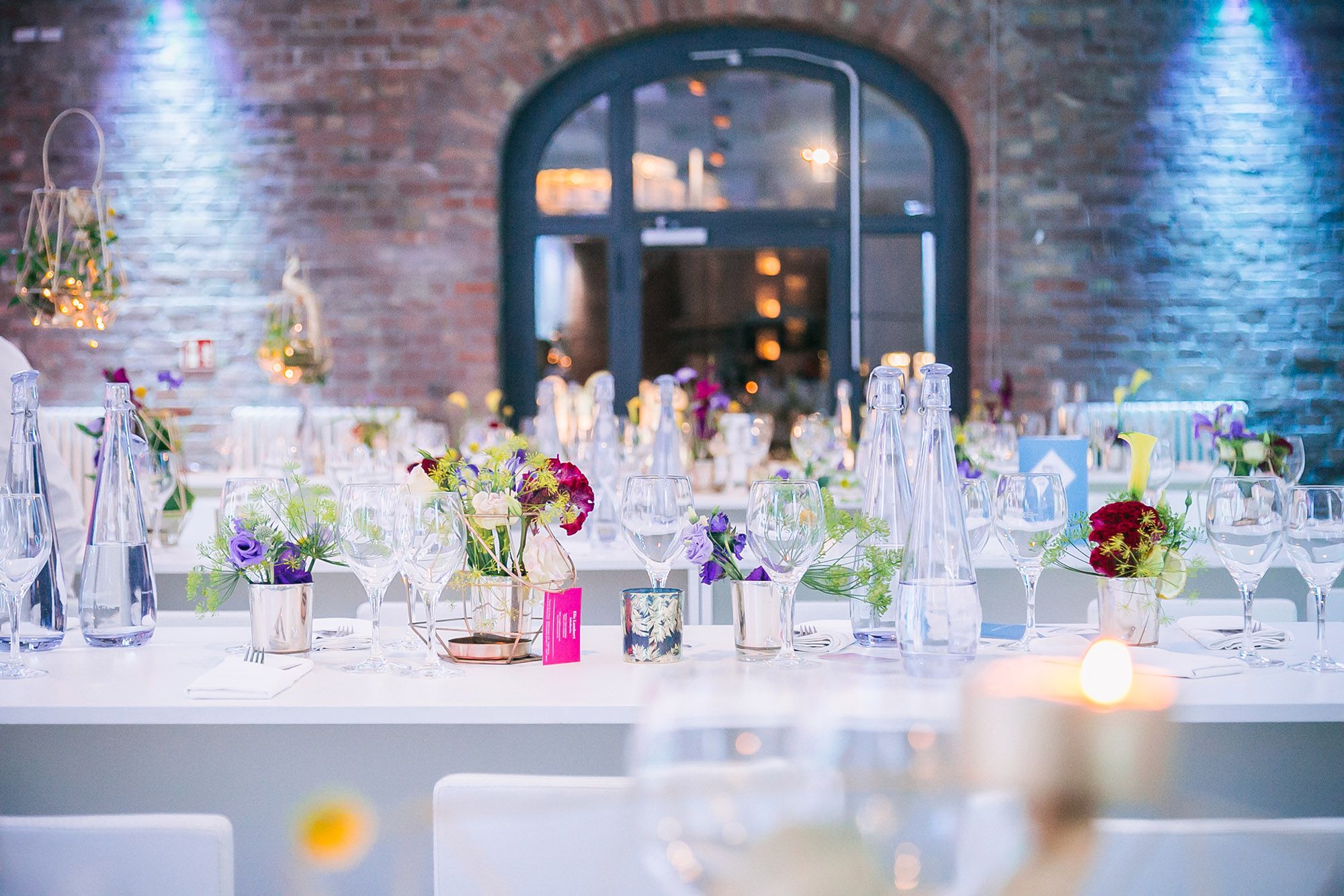 Table set against a historic brick wall